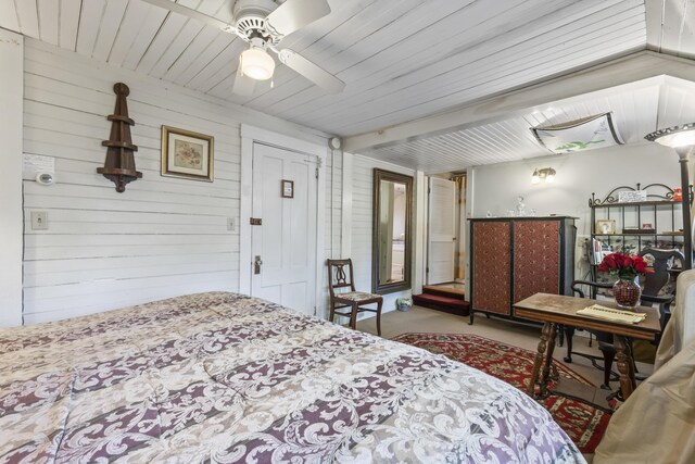 9 Dry Point Dr, Rome, ME 04963 - carpeted bedroom featuring wood walls, wooden ceiling, and a ceiling fan