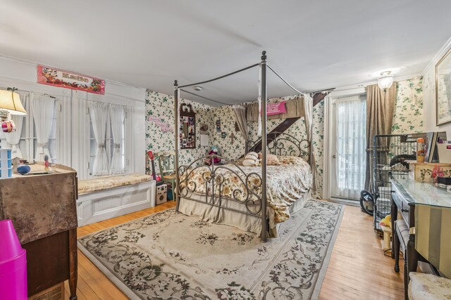 9 Dry Point Dr, Rome, ME 04963 - bedroom with wallpapered walls and wood finished floors