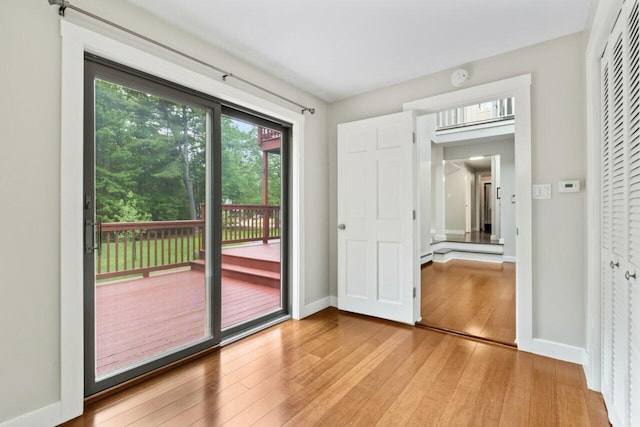20 Cobble Hill Rd, New Gloucester, ME 04260 - unfurnished bedroom with light wood-style floors, access to outside, and baseboards