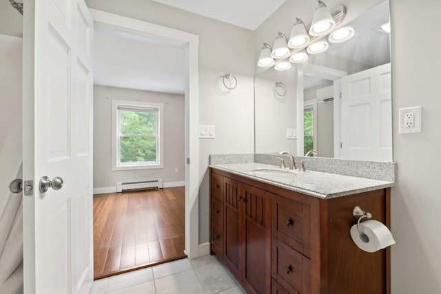 20 Cobble Hill Rd, New Gloucester, ME 04260 - bathroom featuring vanity, baseboard heating, baseboards, and wood finished floors