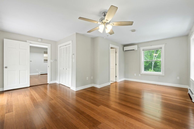 20 Cobble Hill Rd, New Gloucester, ME 04260 - unfurnished bedroom with an AC wall unit, wood finished floors, baseboards, baseboard heating, and a ceiling fan