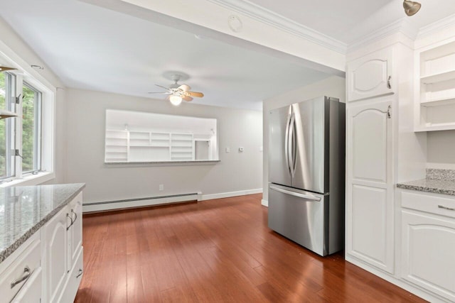 20 Cobble Hill Rd, New Gloucester, ME 04260 - kitchen with freestanding refrigerator, a baseboard heating unit, ceiling fan, white cabinets, and light stone counters