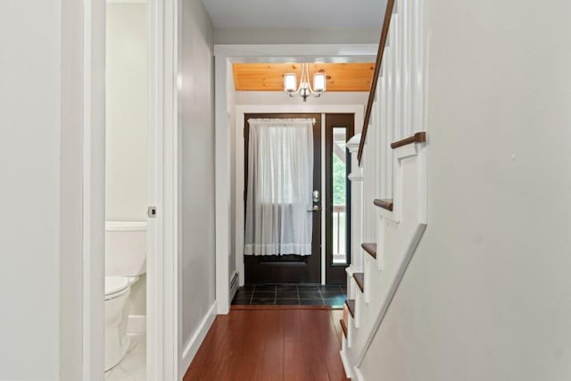 20 Cobble Hill Rd, New Gloucester, ME 04260 - entryway with a chandelier, dark wood-type flooring, a baseboard radiator, baseboards, and stairway