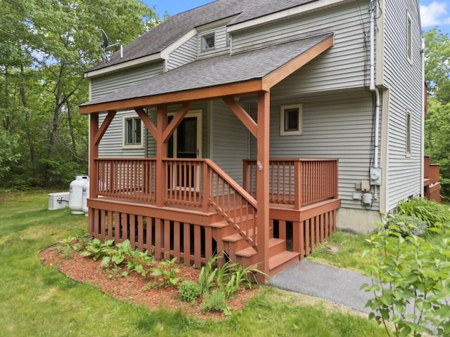 20 Cobble Hill Rd, New Gloucester, ME 04260 - rear view of property with roof with shingles, a yard, and covered porch