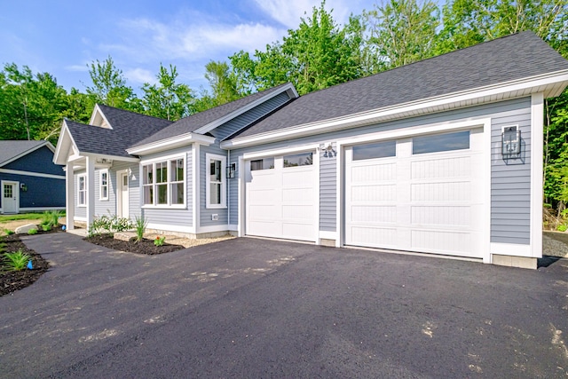 19 Efficiency Way, Bridgton, ME 04009 - ranch-style house with asphalt driveway, an attached garage, and roof with shingles