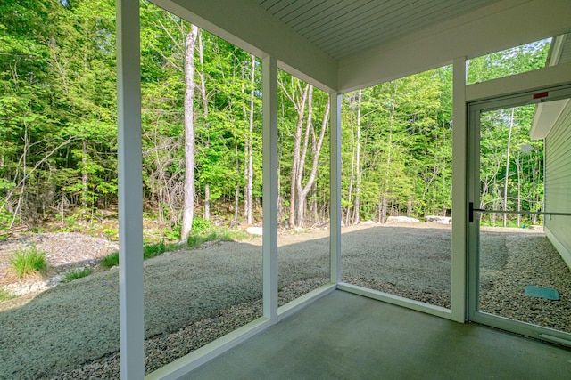 19 Efficiency Way, Bridgton, ME 04009 - unfurnished sunroom featuring a forest view