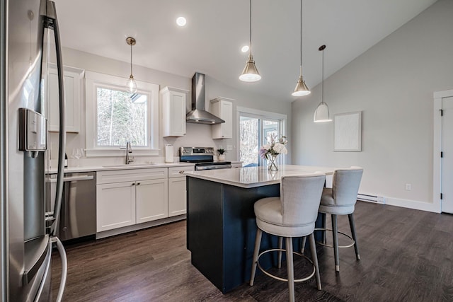 19 Efficiency Way, Bridgton, ME 04009 - kitchen with wall chimney exhaust hood, stainless steel appliances, a sink, dark wood-style floors, and vaulted ceiling