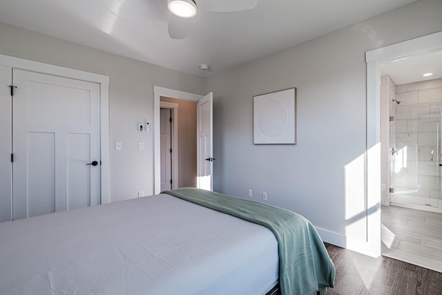 19 Efficiency Way, Bridgton, ME 04009 - bedroom with wood finished floors, ensuite bathroom, baseboards, and a ceiling fan