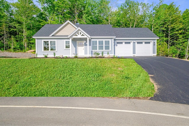 19 Efficiency Way, Bridgton, ME 04009 - view of front of home featuring an attached garage, asphalt driveway, a front yard, and roof with shingles