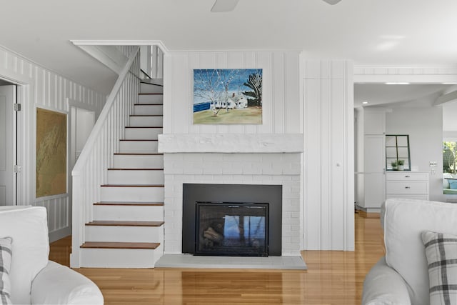 43 Gingers Rd, Harpswell, ME 04079 - living room featuring stairway, wood finished floors, and a fireplace