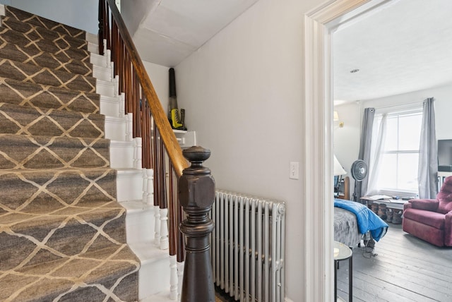 20 Green St, Winthrop, ME 04364 - stairway with radiator and wood-type flooring
