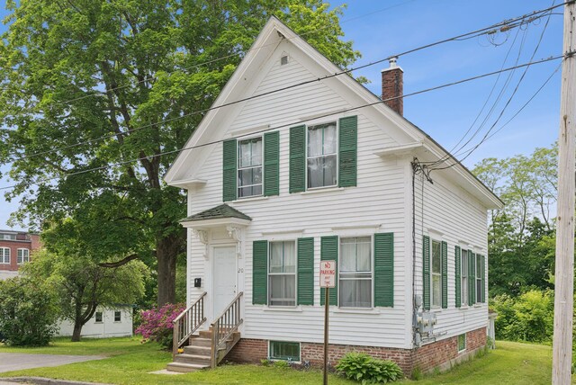 20 Green St, Winthrop, ME 04364 - view of front of home with a chimney, a front lawn, and entry steps
