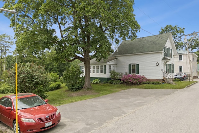 20 Green St, Winthrop, ME 04364 - view of front facade with a shingled roof and a front lawn