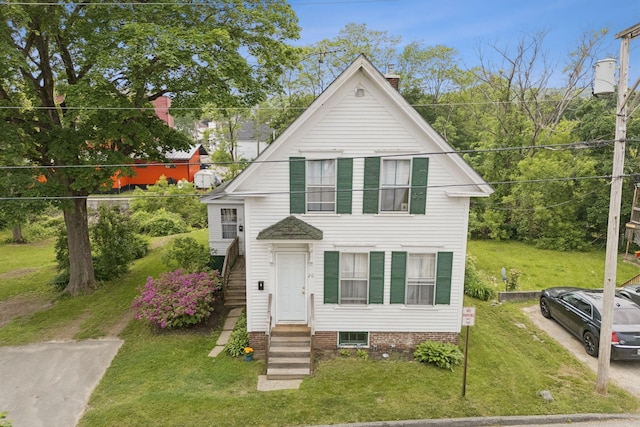 20 Green St, Winthrop, ME 04364 - view of front of home with a front yard, entry steps, and a chimney