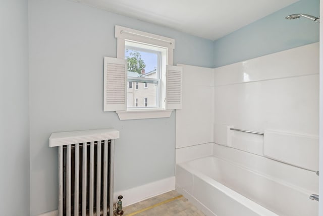 20 Green St, Winthrop, ME 04364 - full bath with radiator, wood finished floors, tub / shower combination, and baseboards