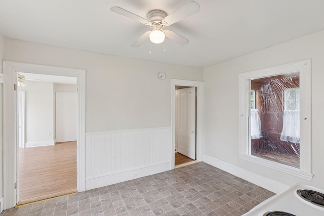 20 Green St, Winthrop, ME 04364 - unfurnished room featuring a ceiling fan and a wainscoted wall