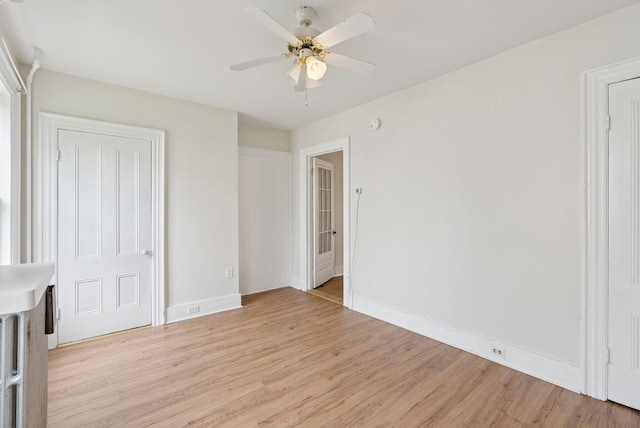 20 Green St, Winthrop, ME 04364 - unfurnished bedroom with light wood-style floors, baseboards, and ceiling fan
