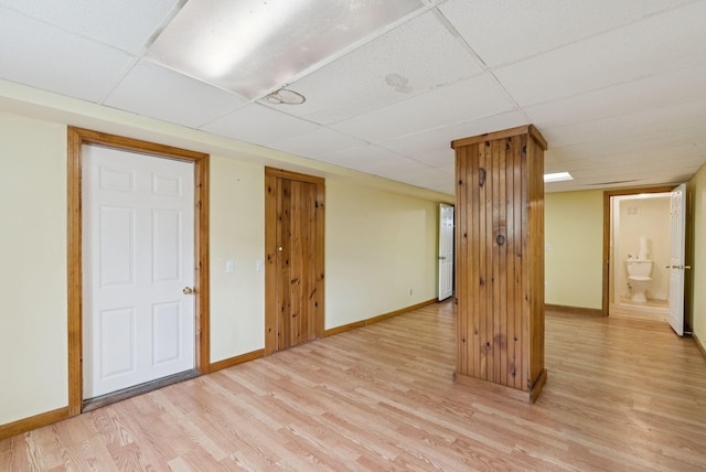 20 Green St, Winthrop, ME 04364 - empty room featuring a paneled ceiling, light wood-type flooring, and baseboards