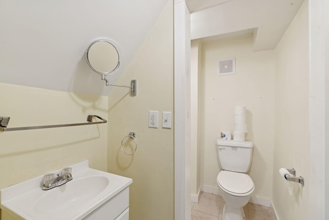 20 Green St, Winthrop, ME 04364 - bathroom featuring toilet, vanity, tile patterned flooring, and baseboards