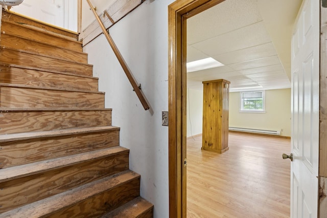 20 Green St, Winthrop, ME 04364 - stairway featuring baseboard heating and wood finished floors
