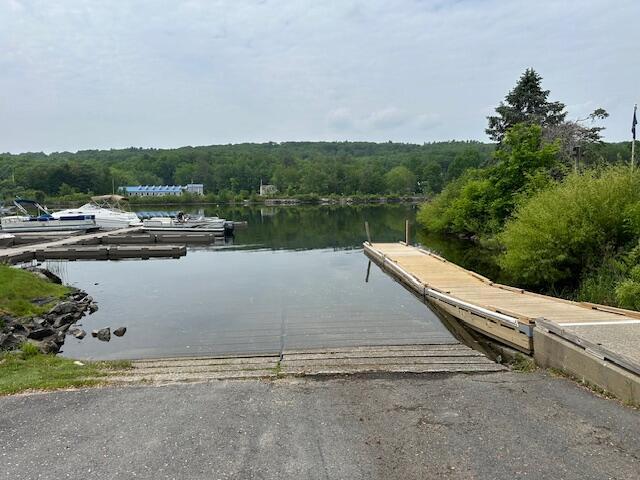 20 Green St, Winthrop, ME 04364 - dock area with a boat ramp, a water view, and a view of trees