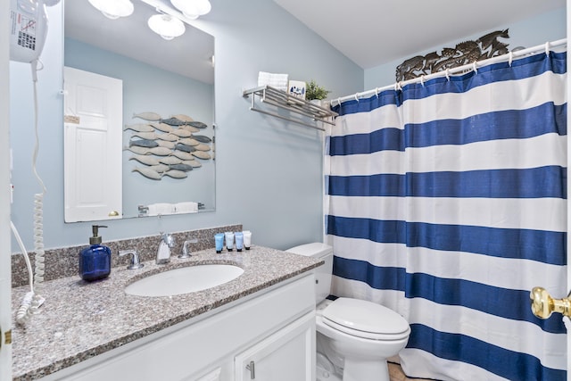 1139 Post Rd Unit 102, Wells, ME 04090 - bathroom featuring toilet, vanity, and a shower with curtain