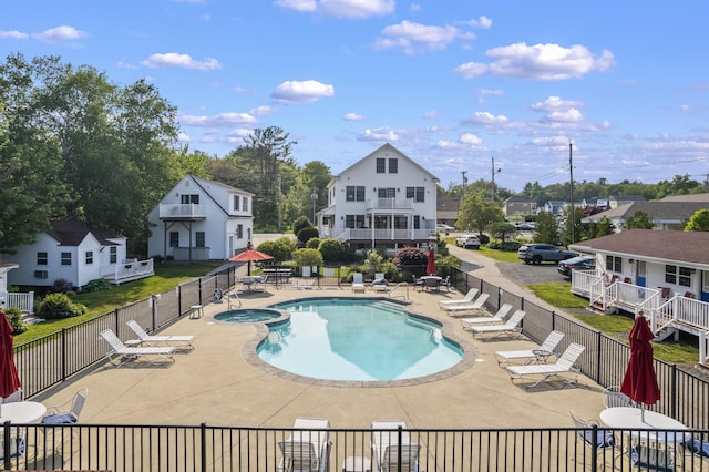 1139 Post Rd Unit 102, Wells, ME 04090 - view of swimming pool with a patio area and a pool with connected hot tub