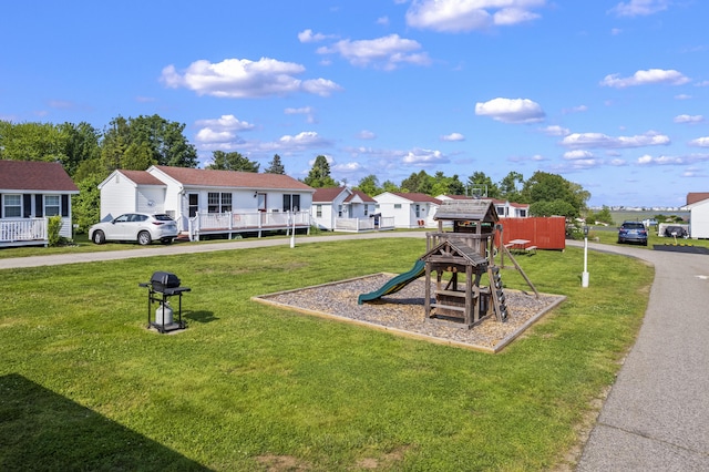 1139 Post Rd Unit 102, Wells, ME 04090 - view of play area with a yard and a residential view