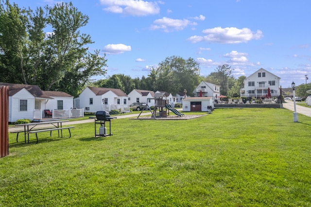 1139 Post Rd Unit 102, Wells, ME 04090 - view of green lawn featuring a playground and a residential view