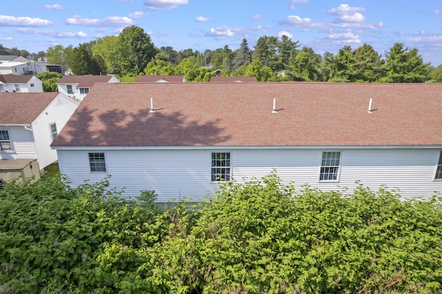 1139 Post Rd Unit 102, Wells, ME 04090 - view of home's exterior featuring a shingled roof