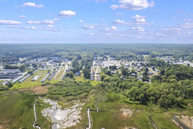 1139 Post Rd Unit 102, Wells, ME 04090 - aerial overview of property's location with a heavily wooded area and a nearby body of water