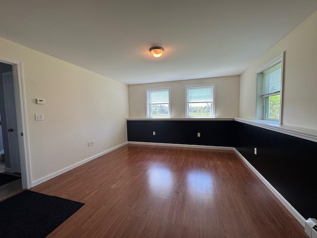 114 Wing Rd, Levant, ME 04456 - unfurnished room with wood finished floors and baseboards