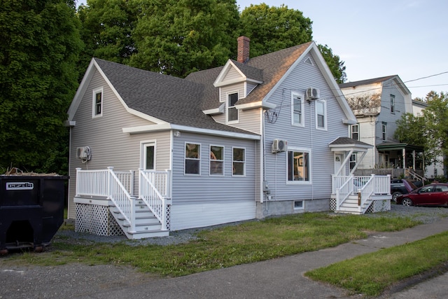 2 Watson Ave, Houlton, ME 04730 - view of front of property featuring a shingled roof, a chimney, and a front lawn