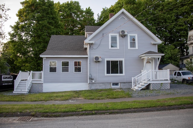 2 Watson Ave, Houlton, ME 04730 - view of front of property featuring roof with shingles, ac unit, and stairs