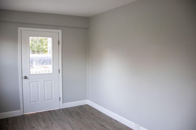 2 Watson Ave, Houlton, ME 04730 - doorway to outside featuring dark wood-type flooring and baseboards