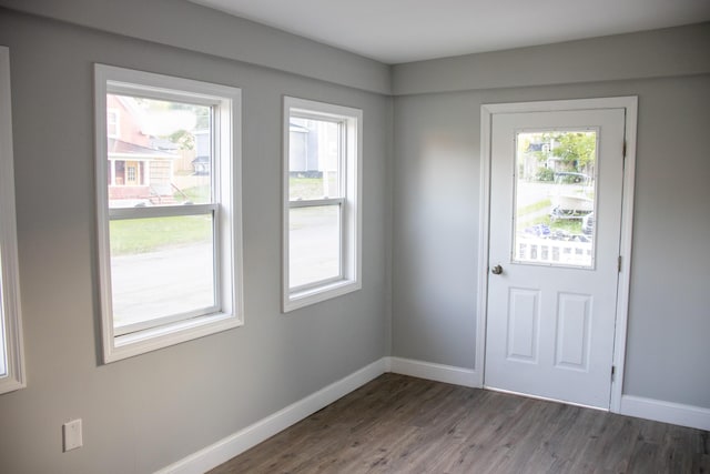 2 Watson Ave, Houlton, ME 04730 - doorway to outside featuring wood finished floors and baseboards