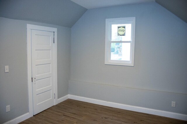 2 Watson Ave, Houlton, ME 04730 - additional living space featuring vaulted ceiling, baseboards, and dark wood-style flooring