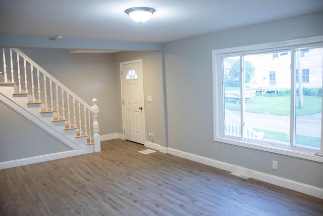 2 Watson Ave, Houlton, ME 04730 - entryway featuring wood finished floors, baseboards, and stairs