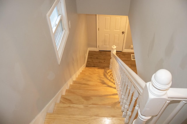 2 Watson Ave, Houlton, ME 04730 - staircase featuring wood finished floors and baseboards