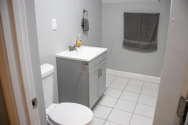 2 Watson Ave, Houlton, ME 04730 - half bathroom featuring vanity, toilet, tile patterned floors, and baseboards