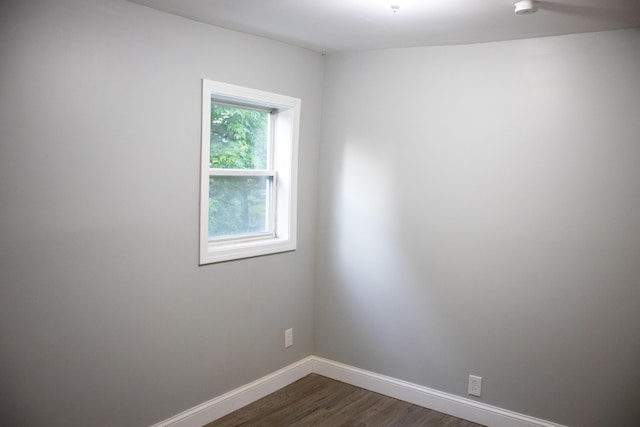 2 Watson Ave, Houlton, ME 04730 - empty room featuring dark wood-type flooring, baseboards, and a smoke detector