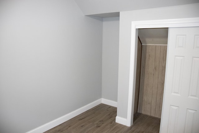2 Watson Ave, Houlton, ME 04730 - unfurnished bedroom with dark wood-style flooring, baseboards, and a closet