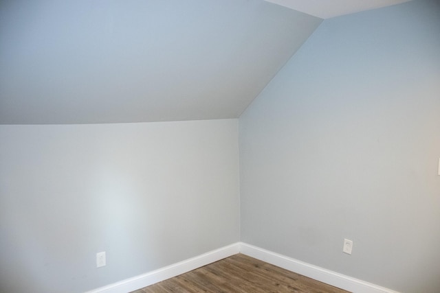2 Watson Ave, Houlton, ME 04730 - bonus room featuring vaulted ceiling, baseboards, and dark wood-type flooring