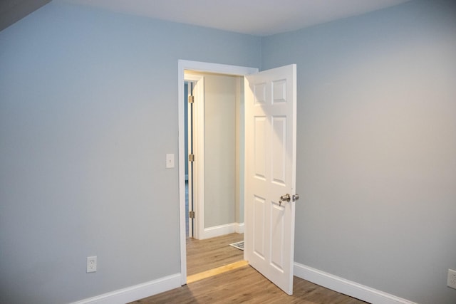 2 Watson Ave, Houlton, ME 04730 - empty room with wood finished floors and baseboards