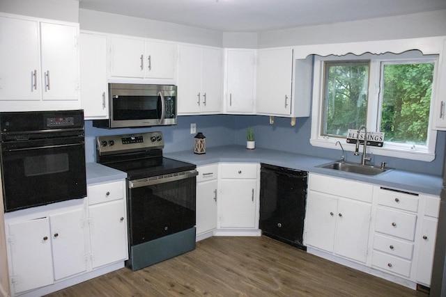 2 Watson Ave, Houlton, ME 04730 - kitchen featuring black appliances, a sink, white cabinets, and dark wood-type flooring