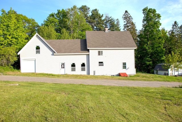 16 Gerry Rd, Sherman, ME 04776 - view of front of home with a front yard, roof with shingles, a garage, and a chimney