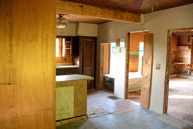 16 Gerry Rd, Sherman, ME 04776 - bathroom with a ceiling fan, wooden walls, and beamed ceiling