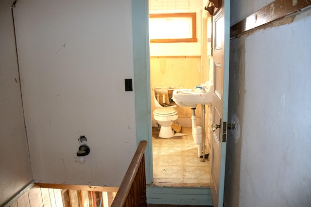 16 Gerry Rd, Sherman, ME 04776 - bathroom with toilet, a sink, and tile patterned floors