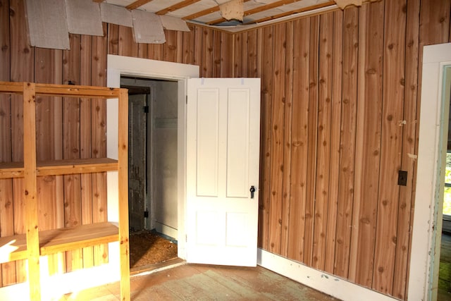 16 Gerry Rd, Sherman, ME 04776 - unfurnished bedroom with wood walls and wood finished floors