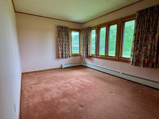 02 Rogers St, Houlton, ME 04730 - carpeted spare room with crown molding, plenty of natural light, baseboards, and a baseboard radiator